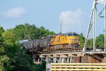 A westbound UP train starts across the Neches River Lift Bridge